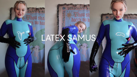 Blue Latex Blonde Unzips Catsuit for Fingering and Vibrator Ride